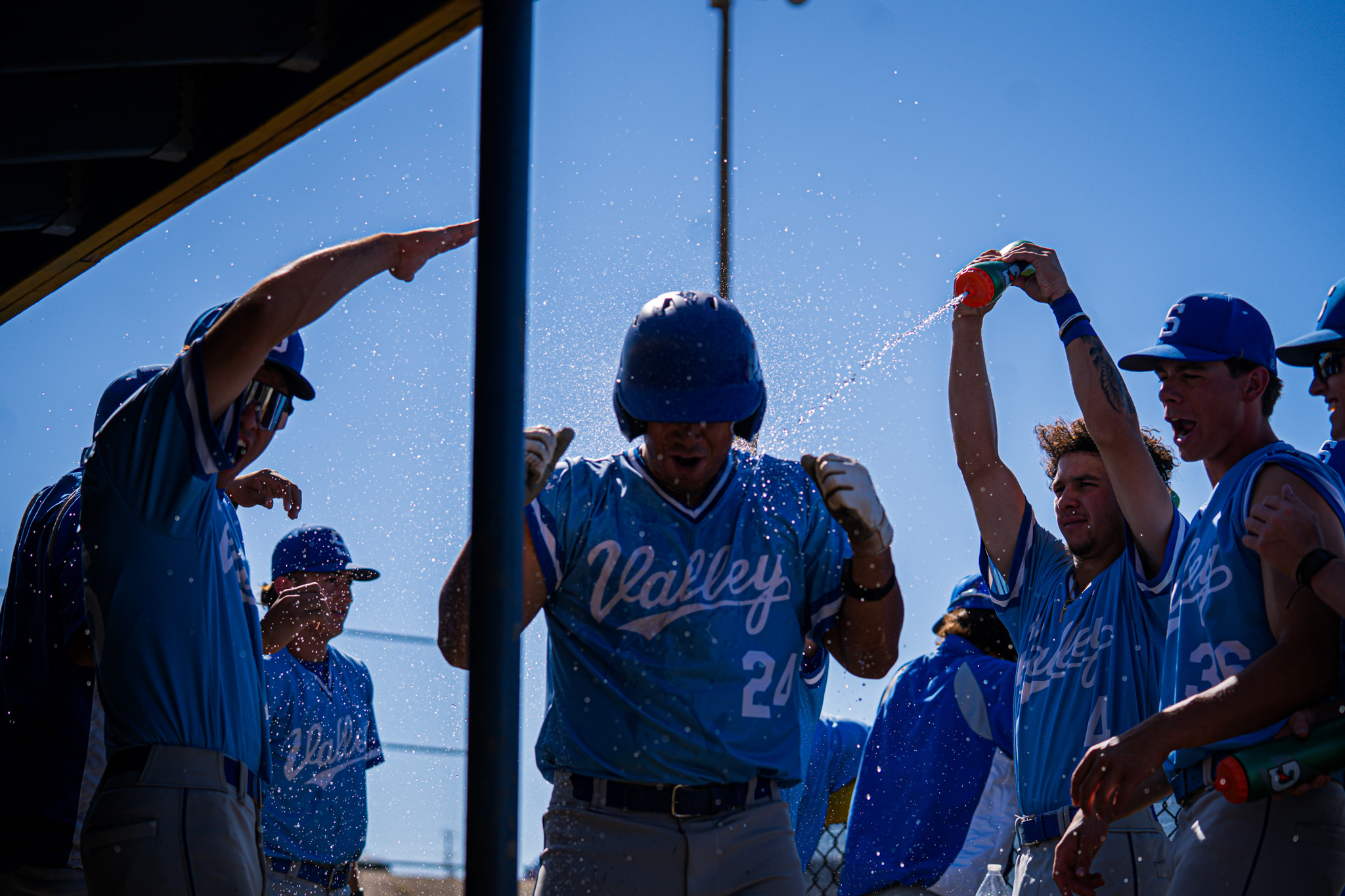 Celebration in dugout after scoring run