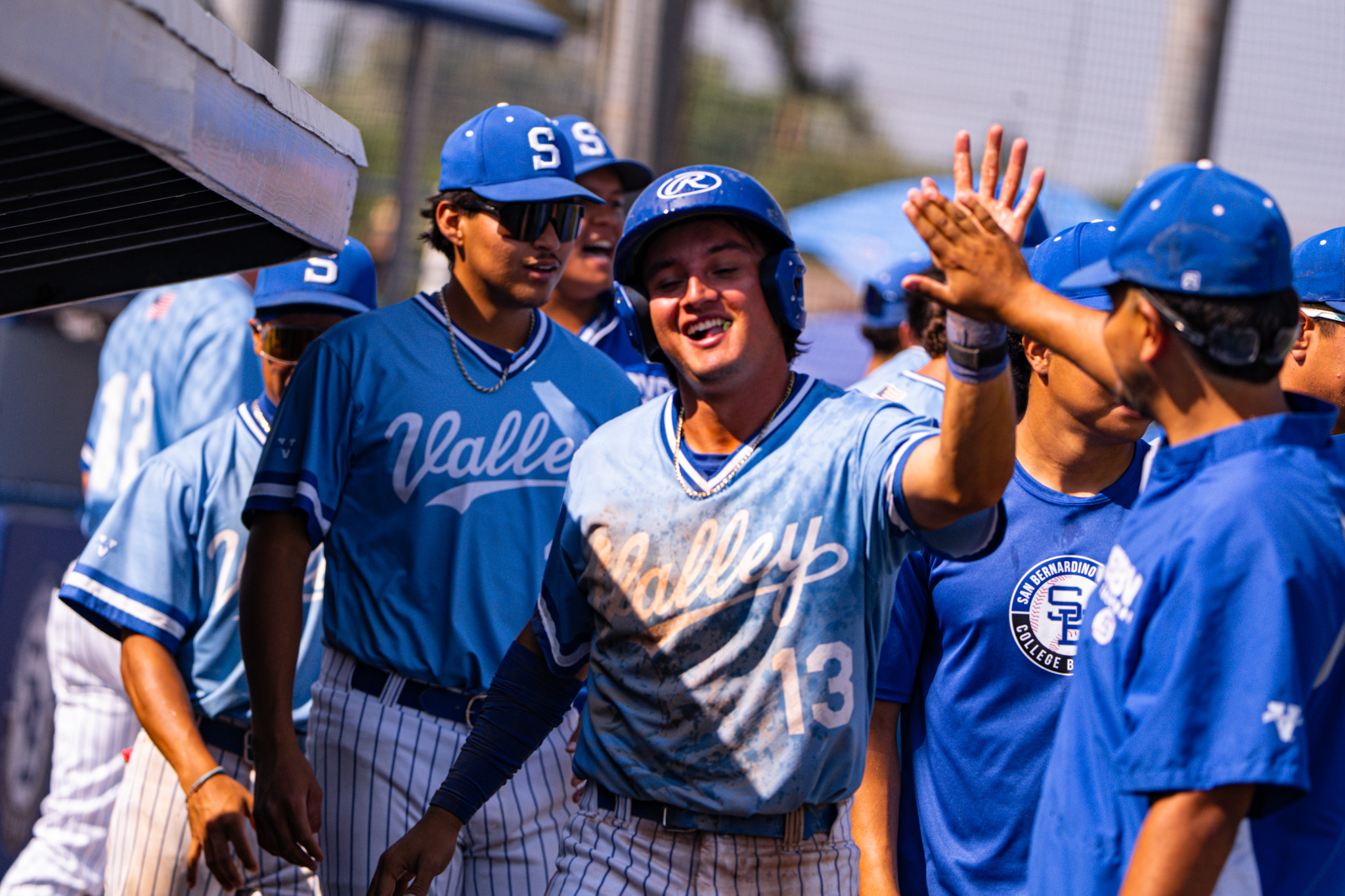 Tomas Melesio/SBVC Athletics
Adrian Diaz gets congratulated after returning to the dugout.
